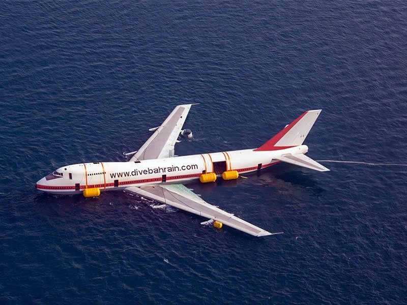 An aerial shot of the aircraft during the process of being submerged