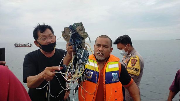 Salvage Teams Recover 'Body Parts' in Huge Search For Indonesian Plane Crash Wreckage