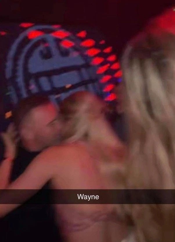 Rooney pictured with a blonde clubber
