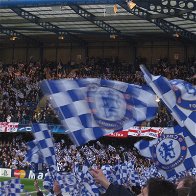 Chelsea fans celebrating at Stamford Bridge.