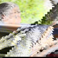 Image of a pensioner driving a car.