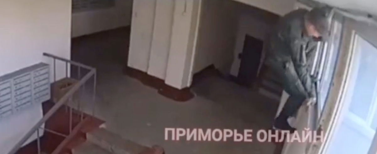 WATCH: Russian military enlistment officer climbs through apartment ...