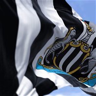 Image of Newcastle United's flag blowing in the wind.
