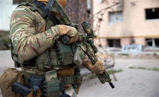 Image of a soldier holding a weapon.