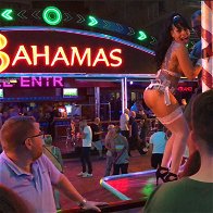 Image of a girl dancing on a podium in Benidorm.