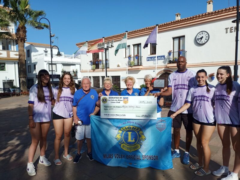 Lion-hearted support: La Cala Lions present cheque to local volleyball team