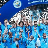 Image of Manchester City winning the 2023 Champions League trophy.