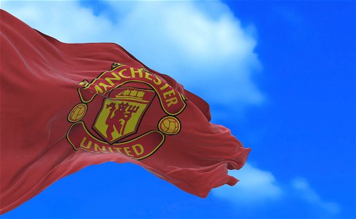 A flag with Manchester United's badge blowing in the wind.