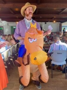 guest in texas costume with horse
