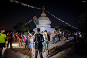 hikers at night with buddhist monument