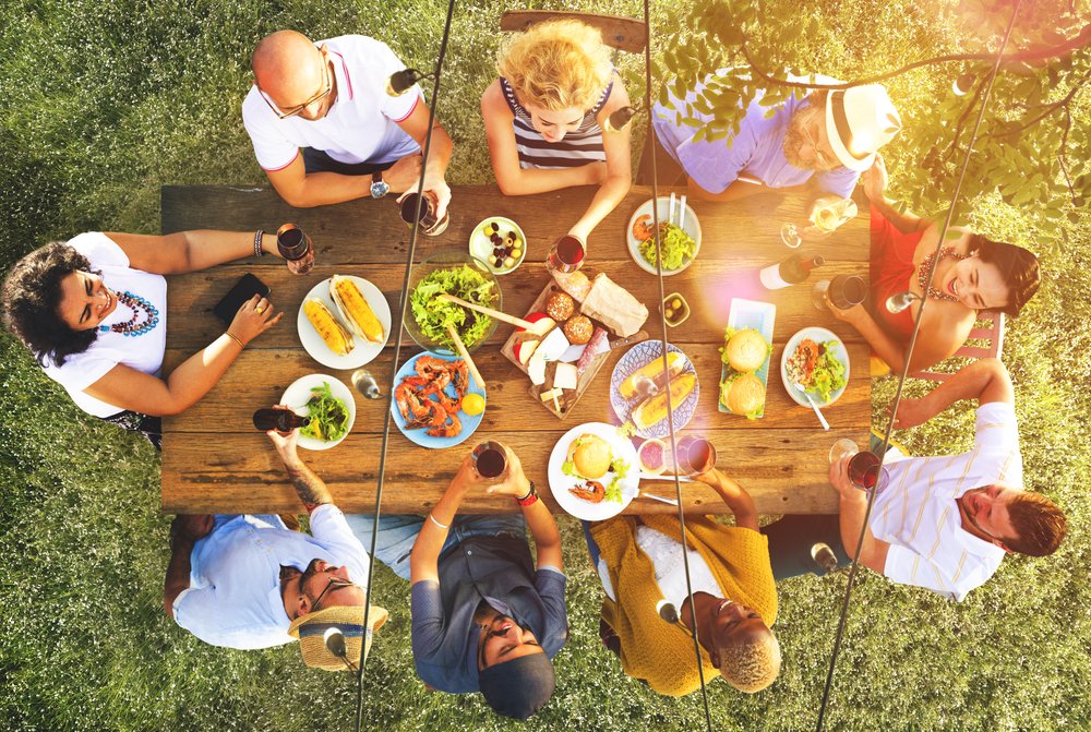 a group of people eating together from above