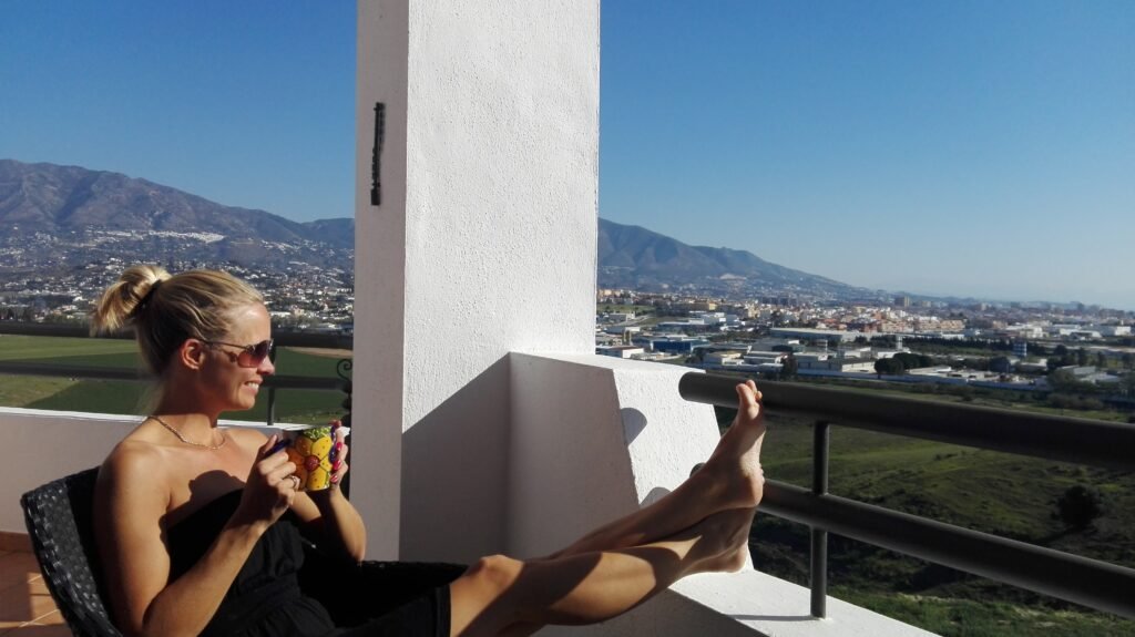Costa del Sol living, sipping coffee on a balcony in the sun.