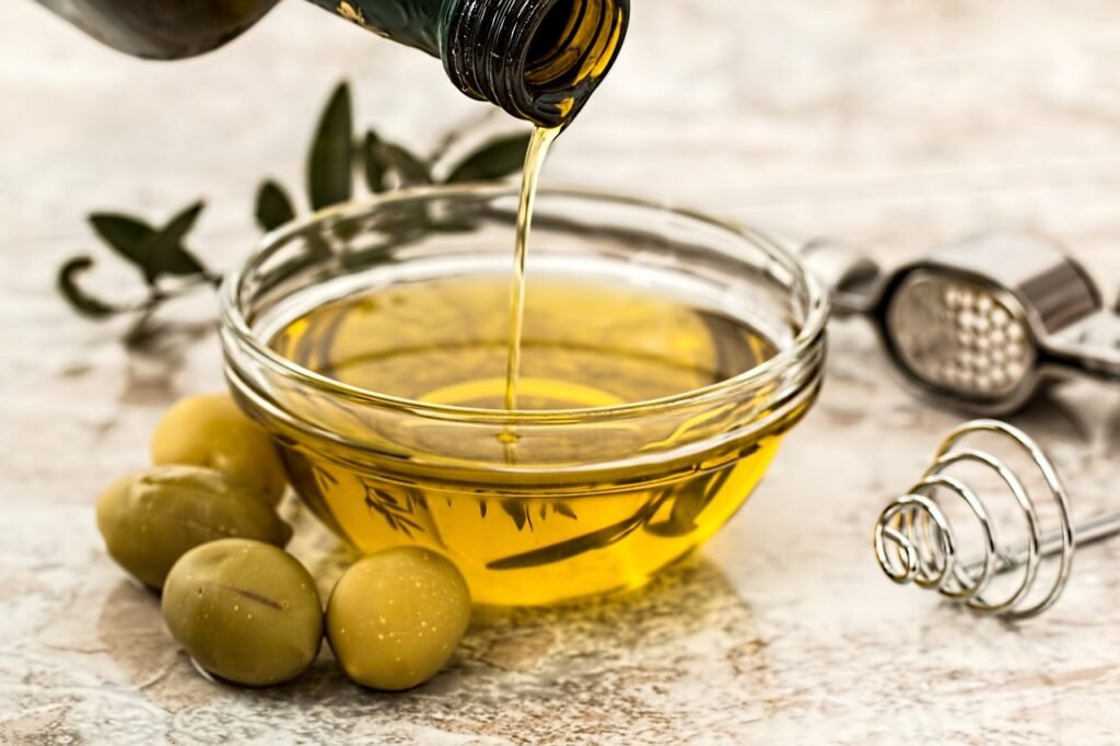 A glass bowl containing olive oil