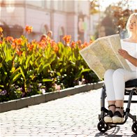 A woman in a wheelchair with a map