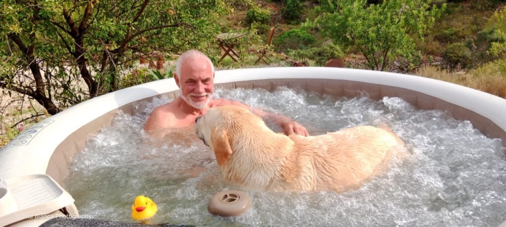 roger in hot tub with dog