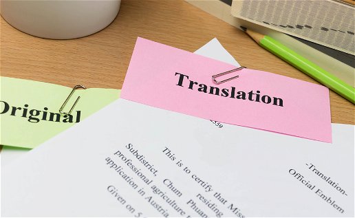 Papers on a desk with original and translation