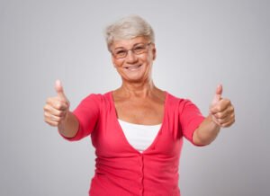 mature lady giving thumbs up sign