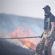A firefighter at a moor fire