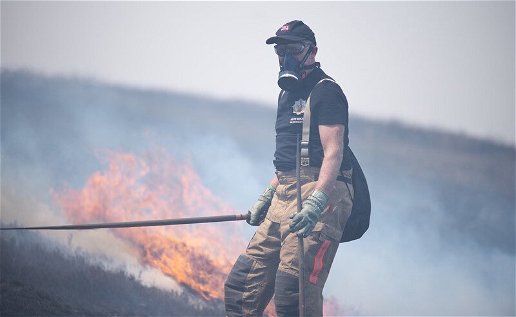 A firefighter at a moor fire
