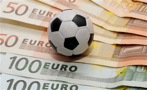 Image of a football on a bed of euros.