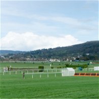 View of Cheltenham racecourse with a hurdle in view