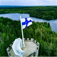 overhead view of top of castle with a flag pole with Finnish flag