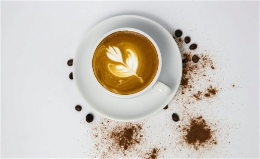 Cup of coffee with leaf design