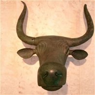 Bronze bull's head, iron age
