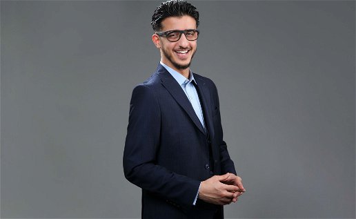 Shaffy Yaqubi in a dark suit wearing glasses
