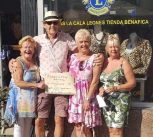 Love in La Cala de Mijas. Euro Weekly News. Karen and Mike donating collection to the Cala de Mijas Lions.