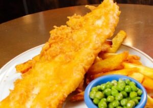 Fish and chips with mushy peas served at the Black Flame