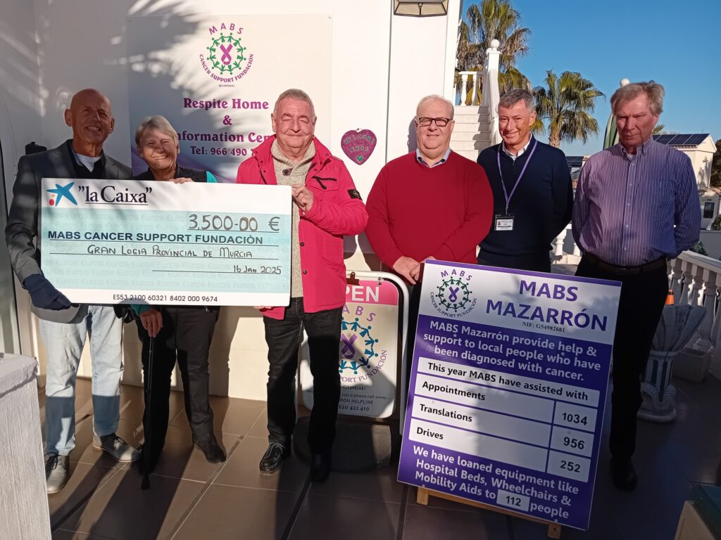 MABS cancer foundation receiving a donation Euro Weekly News
