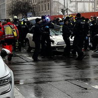 Emergency services and police at the scene in Munich after a Mini Cooper crashed into a crowd of protesters, leaving multiple people injured