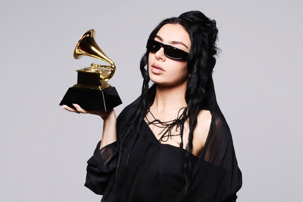 Charli XCX nominated for 5 Brit Awards, holding her 2025 Grammy award. 