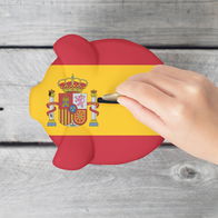 Hand dropping a coin into a piggy bank painted with the Spanish flag on a wooden table — symbolising consumer credit and savings in Spain.