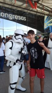 A young man pinch a Storm Trooper.