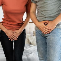 2 adults covering their private area