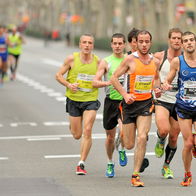 Men running a race in a major city in Spain