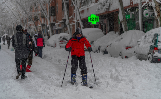 Man on skies travelling through a heavy snowed in Madrid