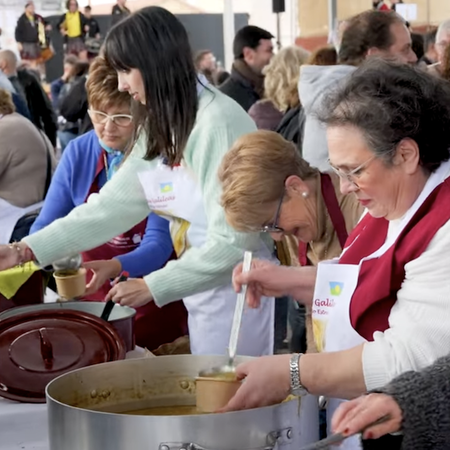 Pedestrians walking through a lively street in Bilbao city centre, northern Spain.