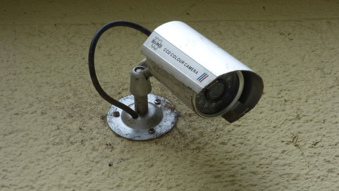 Security camera on a wall