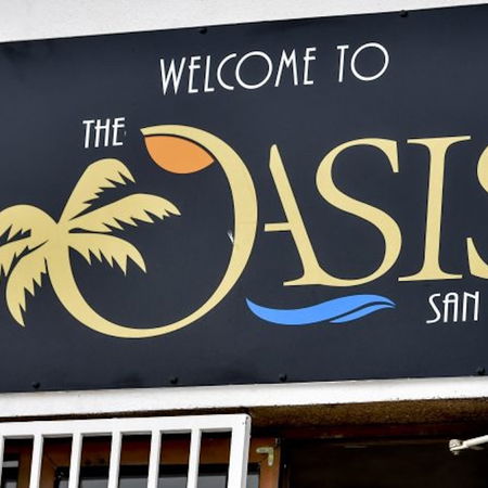 Pedestrians walking through a lively street in Bilbao city centre, northern Spain.