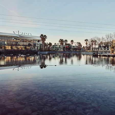 Pedestrians walking through a lively street in Bilbao city centre, northern Spain.