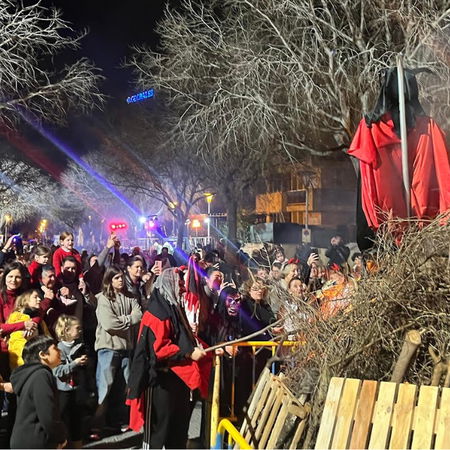 Pedestrians walking through a lively street in Bilbao city centre, northern Spain.